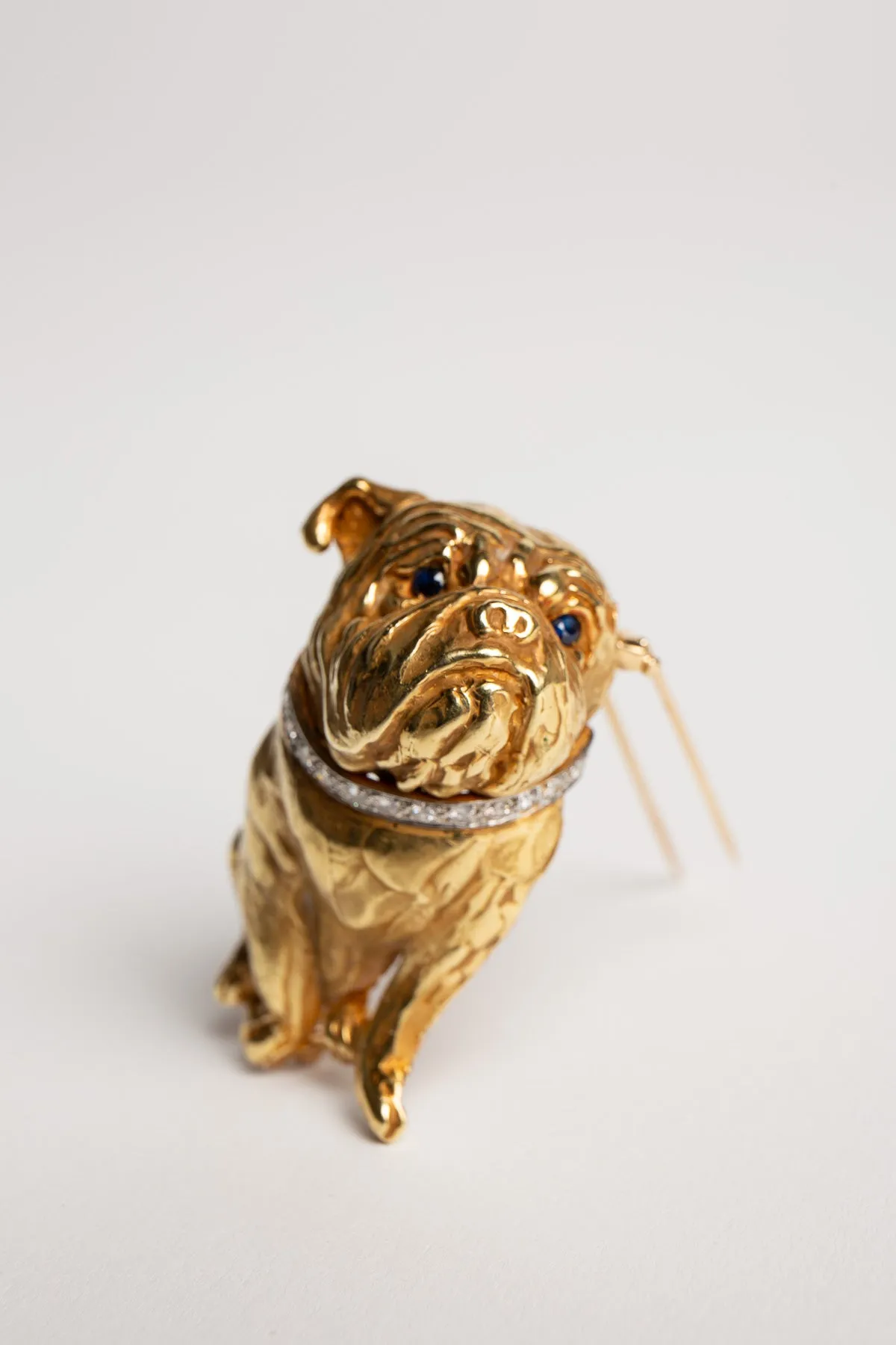 ERWIN PEARL | VINTAGE YELLOW GOLD, DIAMOND, AND SAPPHIRE BULLDOG BROOCH